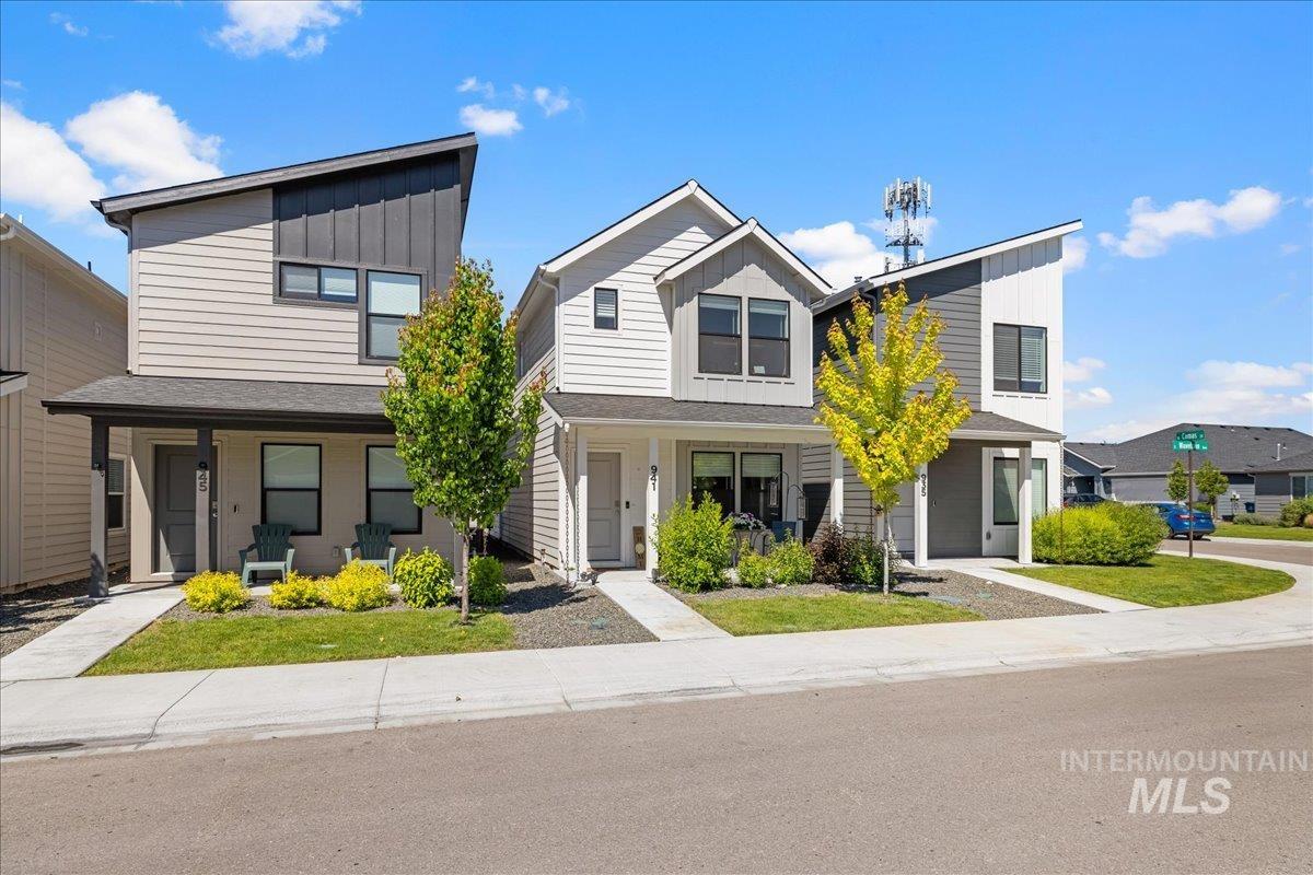 Contemporary house featuring board and batten siding and a porch