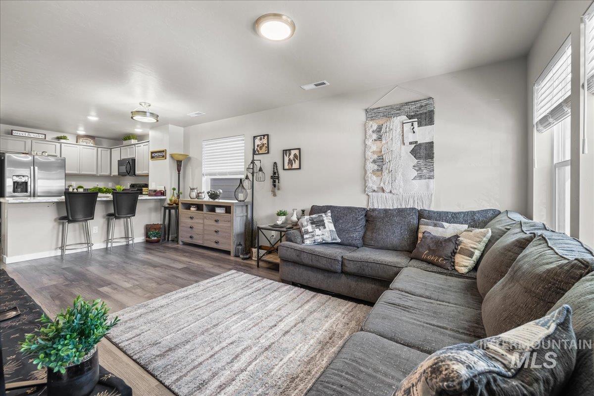 Living room featuring dark wood-type flooring