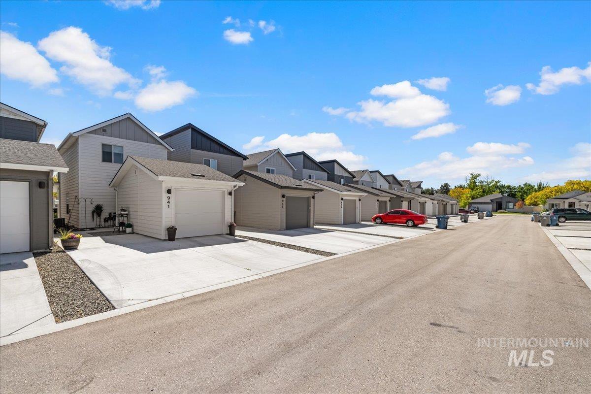 View of asphalt street featuring a residential view