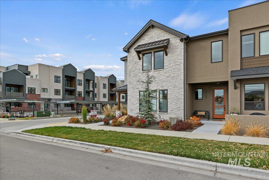View of property with a residential view