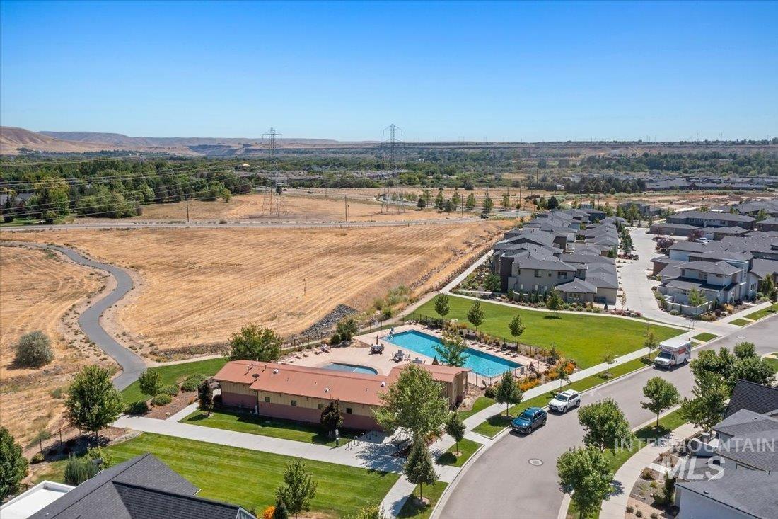 Aerial perspective of suburban area featuring a pool area