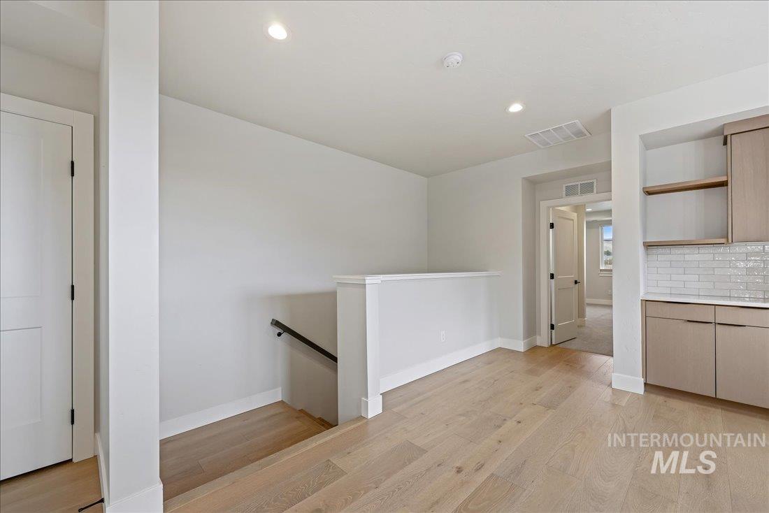 Interior space with recessed lighting and light wood finished floors