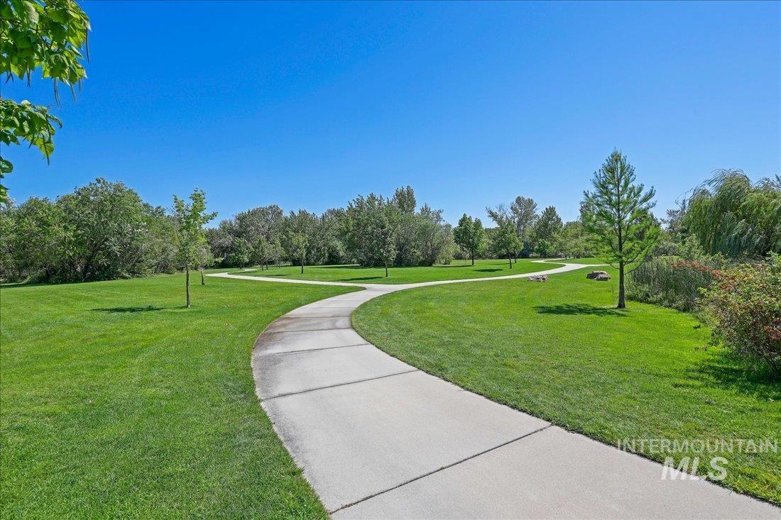 View of community featuring a yard