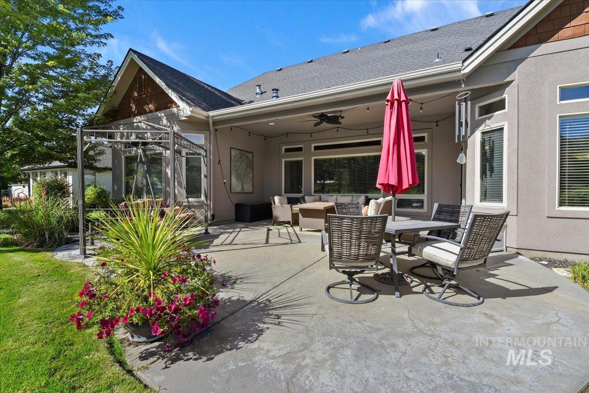 View of patio / terrace with an outdoor living space, a ceiling fan, and outdoor dining space