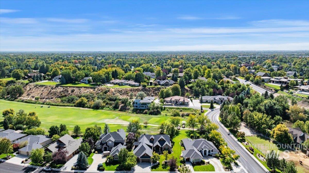 Aerial view of residential area featuring a golf club