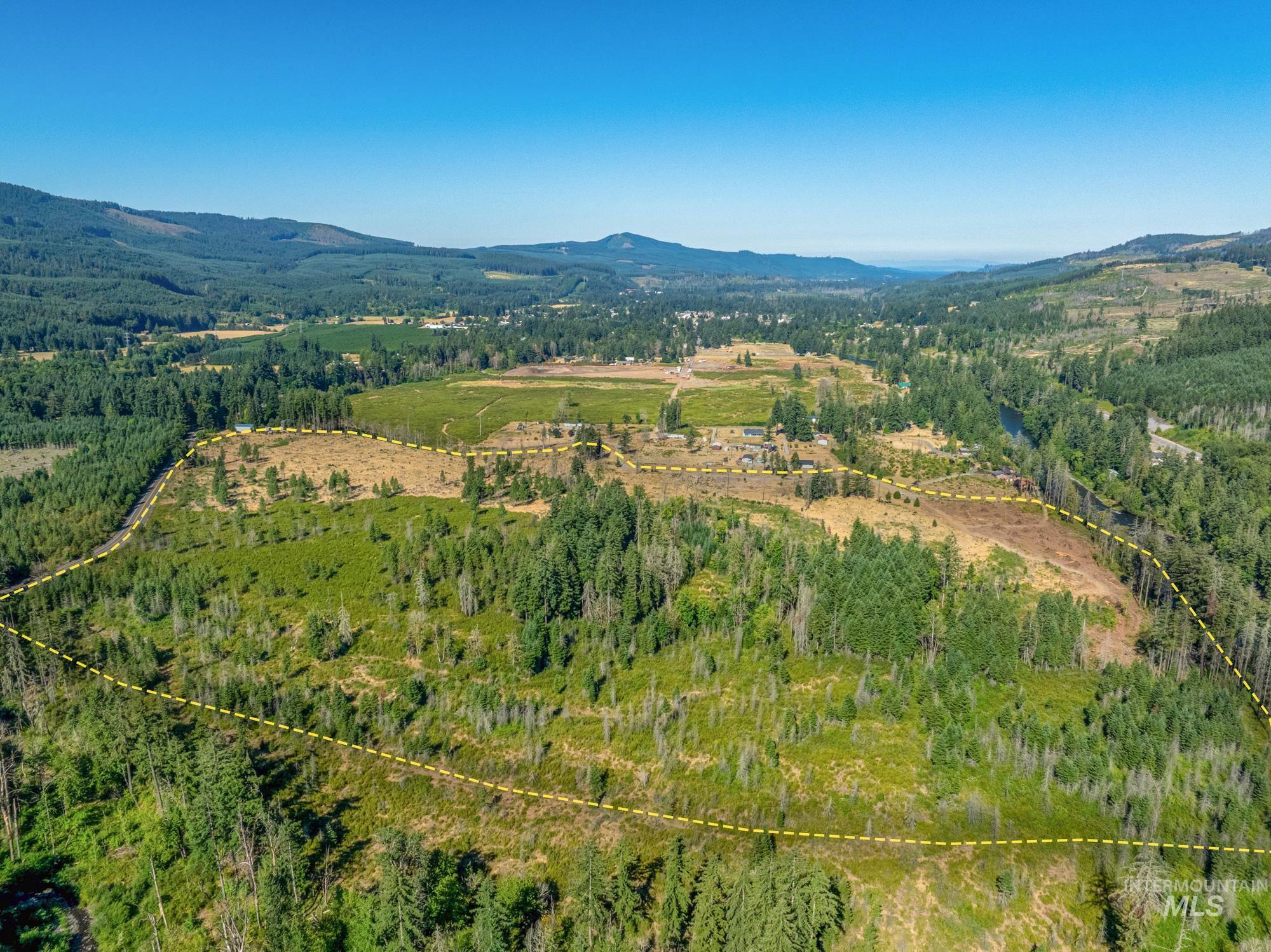 Aerial overview of property's location featuring mountains and property parcel outlined