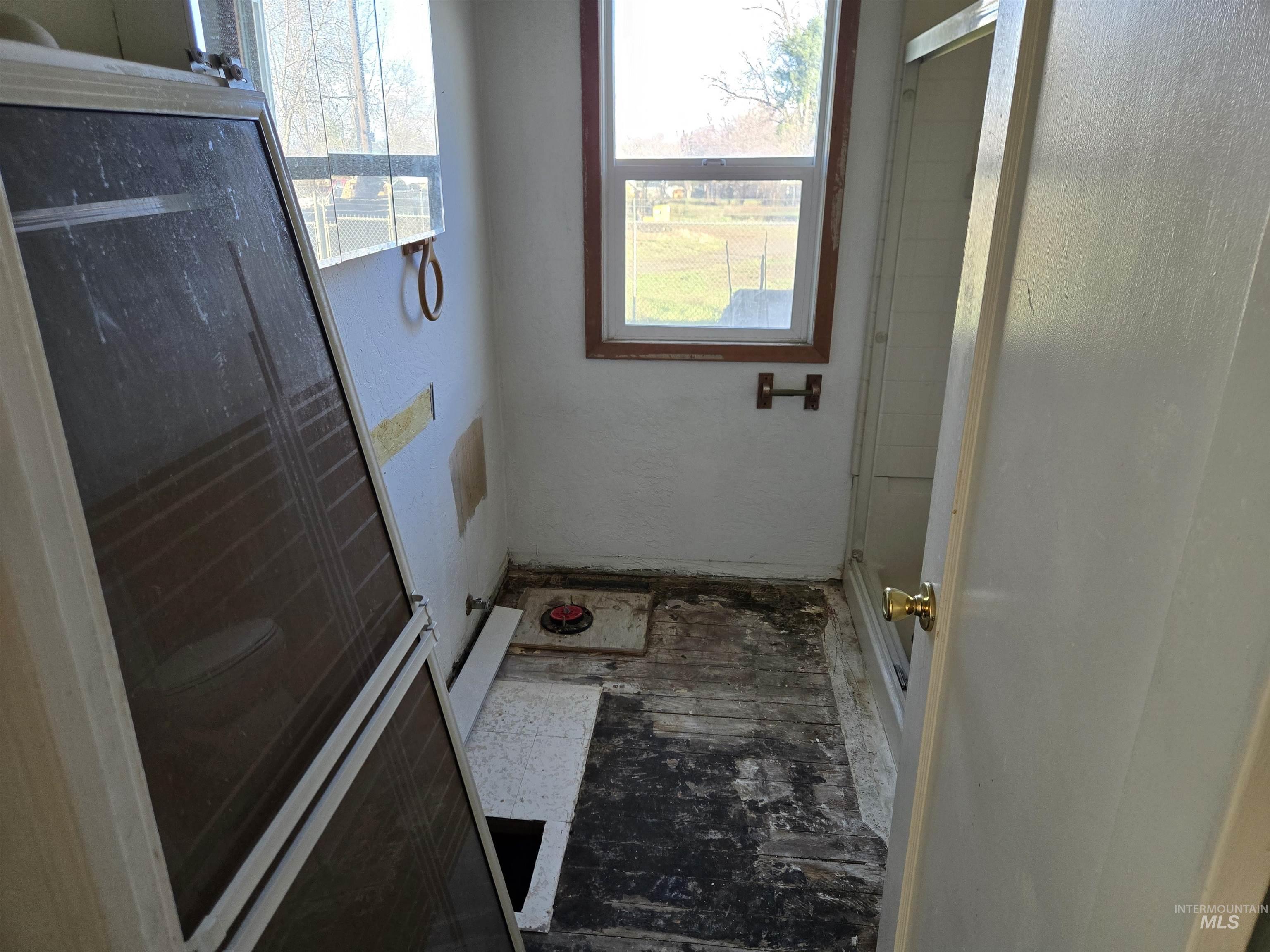 Full bath featuring a stall shower and plenty of natural light