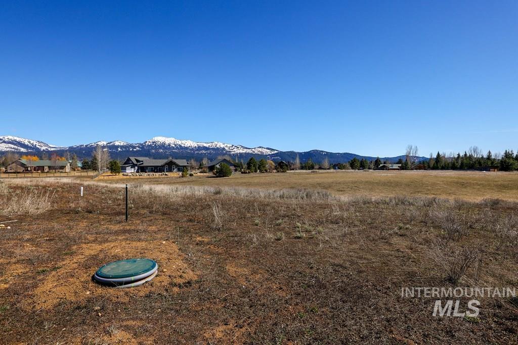 View of mountain backdrop featuring rural landscape