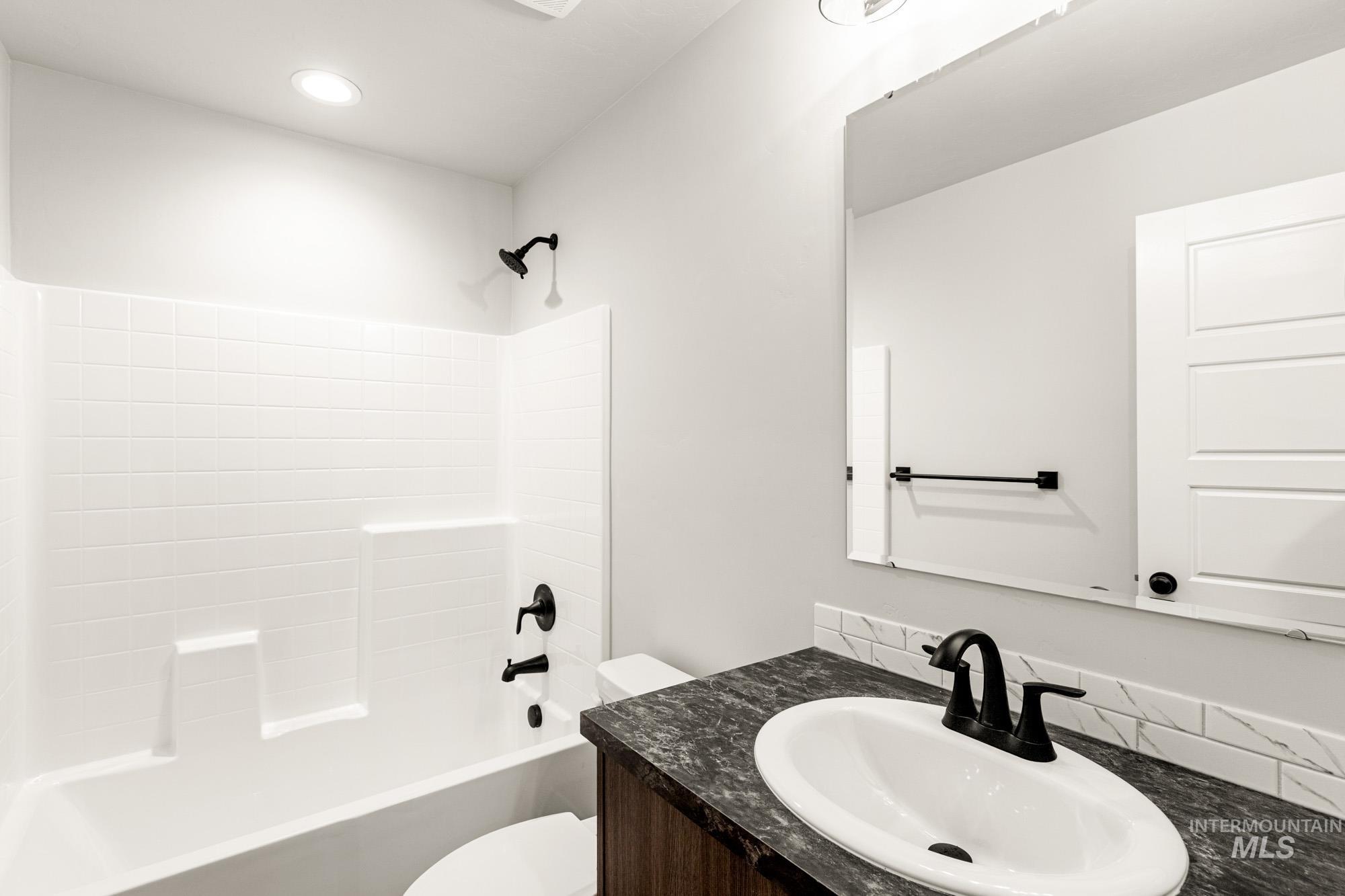 Full bathroom with vanity and shower / bathtub combination