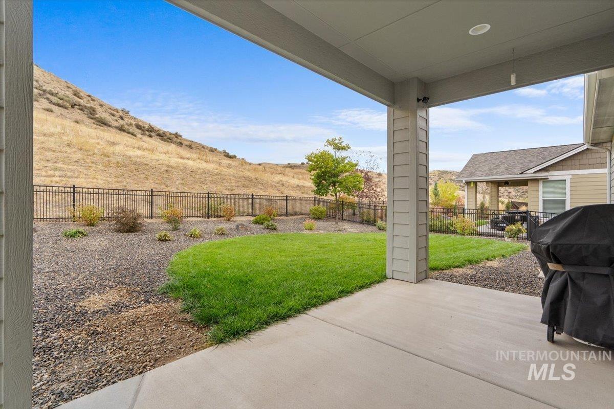 Fenced backyard with a patio area and area for grilling