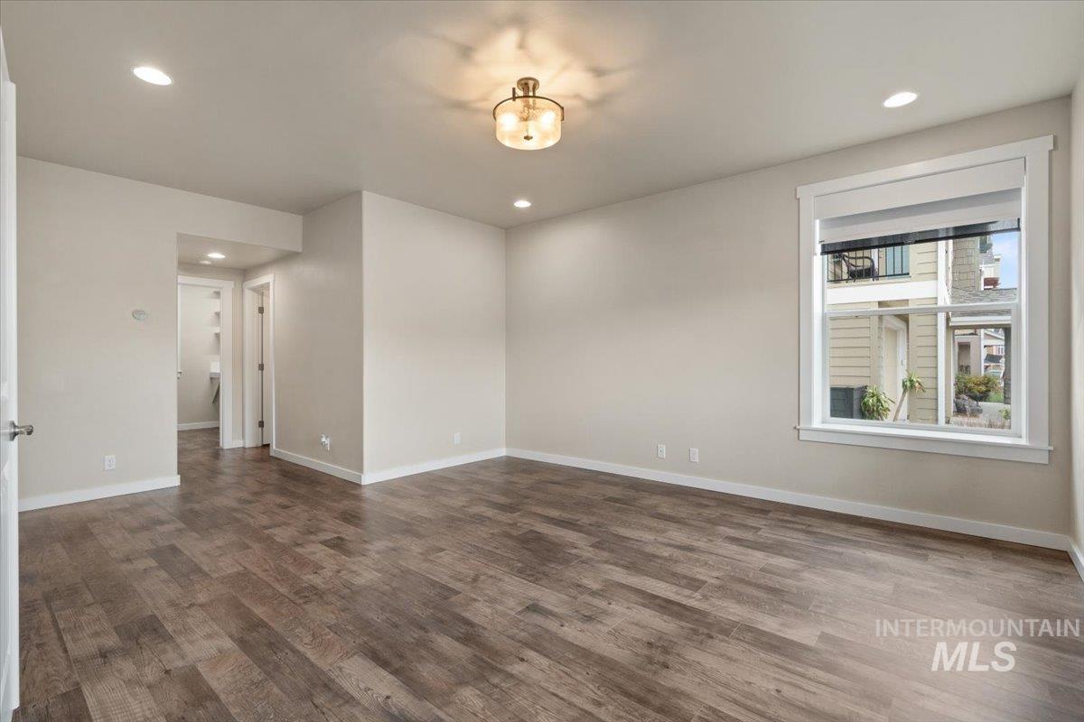 Empty room featuring recessed lighting and wood finished floors