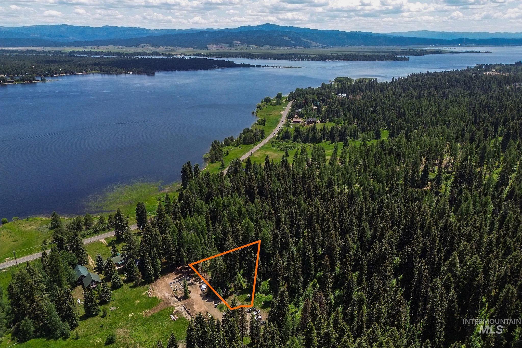 View of property location with a water and mountain view and property boundaries highlighted