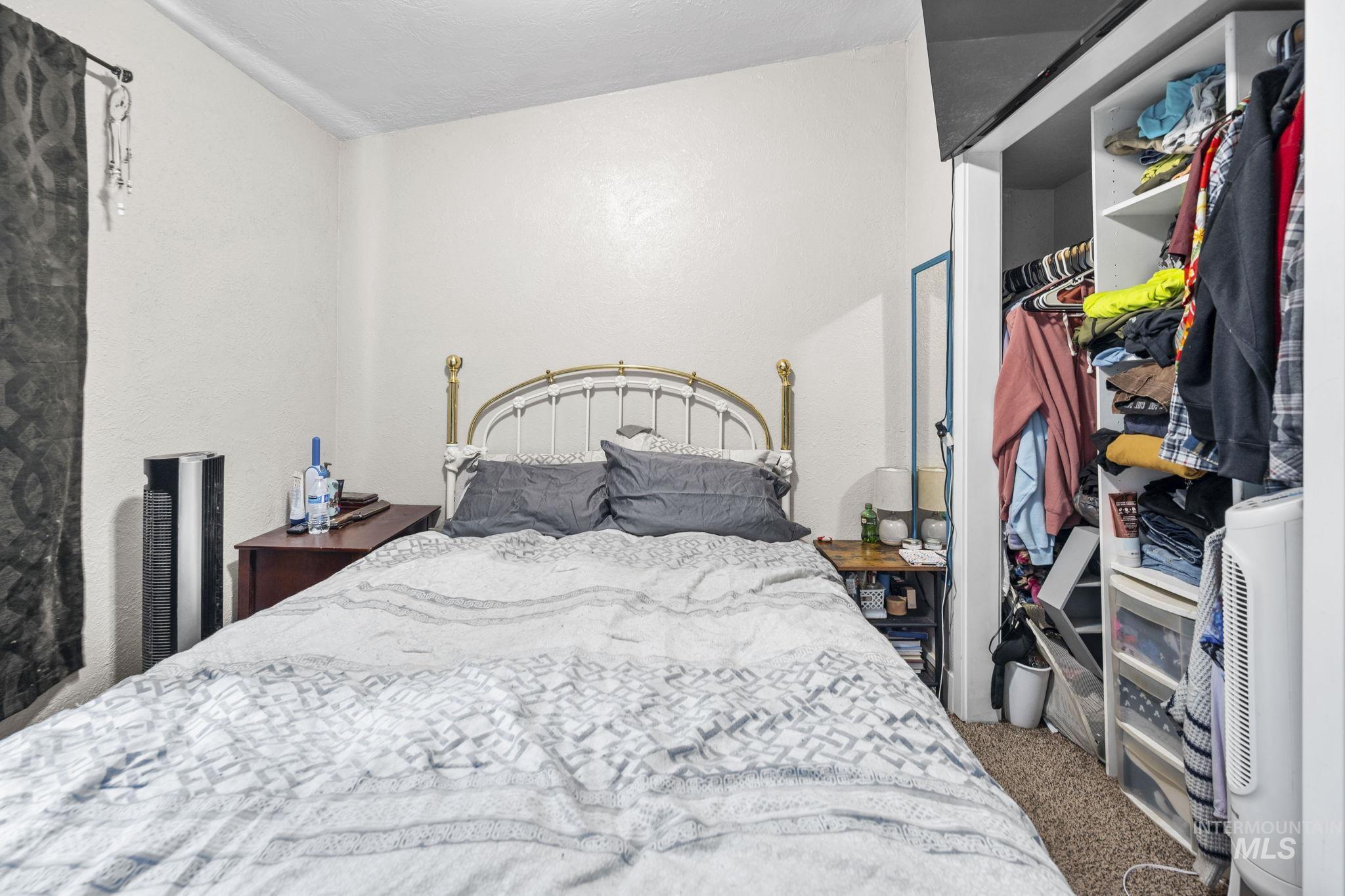 Bedroom with a closet and carpet