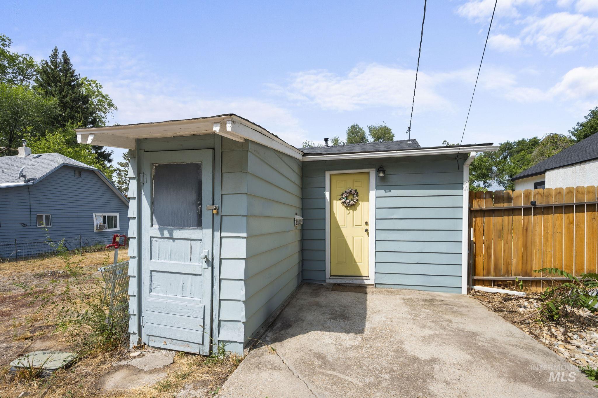 Back of the house with entrance to the basement