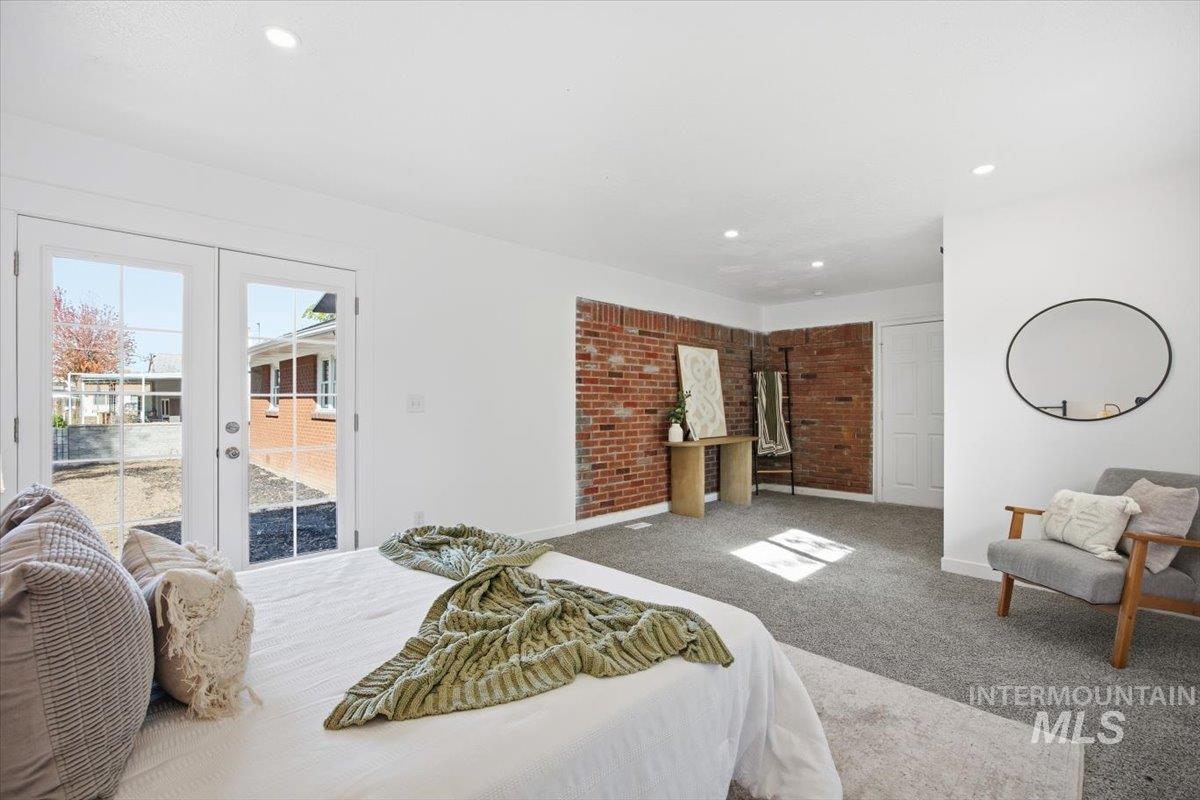 Bedroom featuring carpet flooring, french doors, recessed lighting, and access to exterior