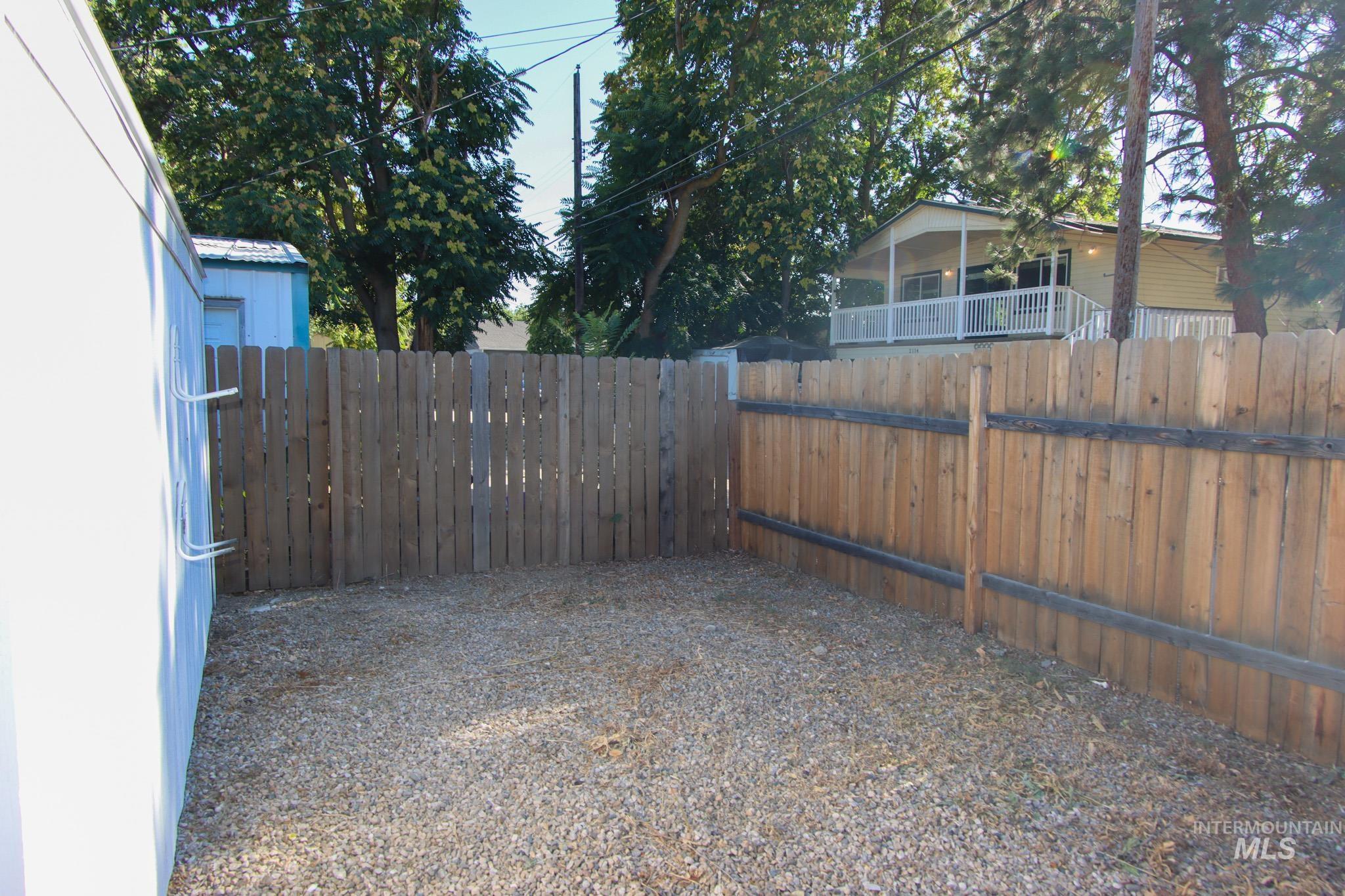 View of fenced backyard