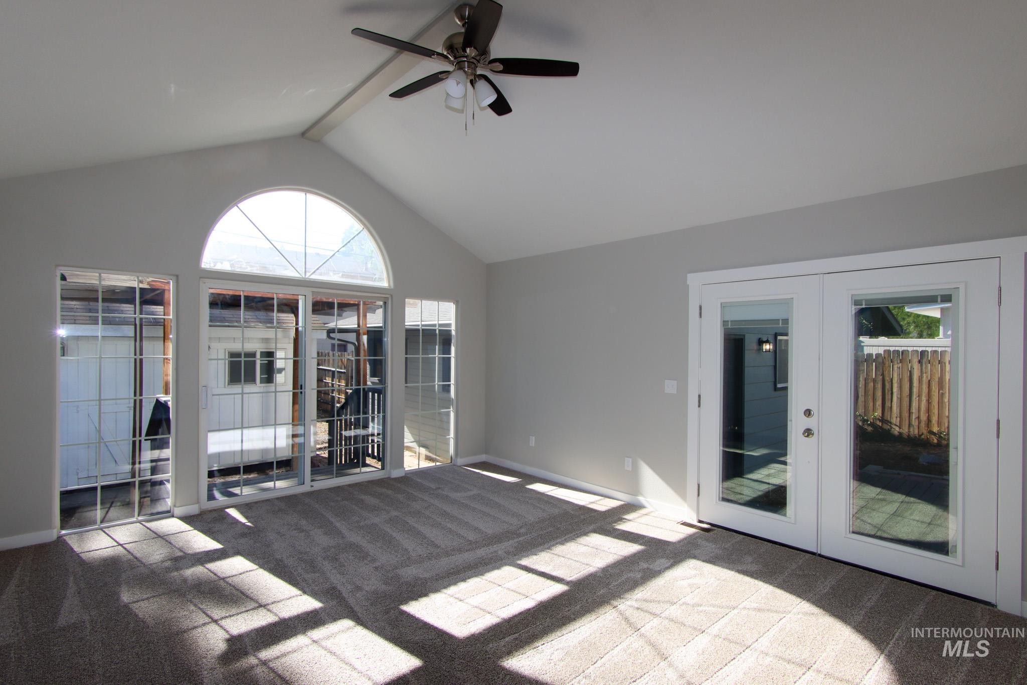 Unfurnished sunroom with french doors