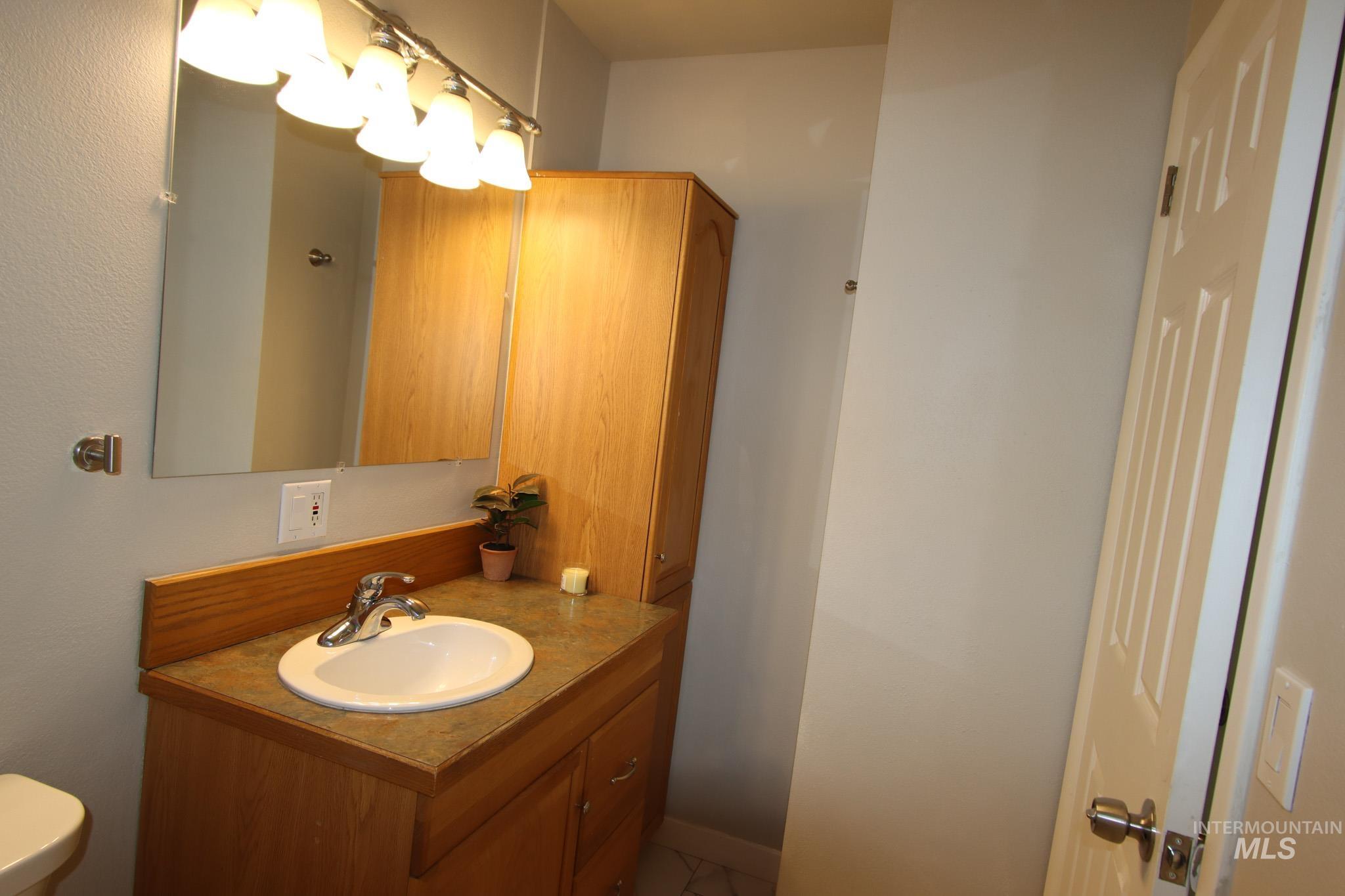 Bathroom featuring vanity and toilet