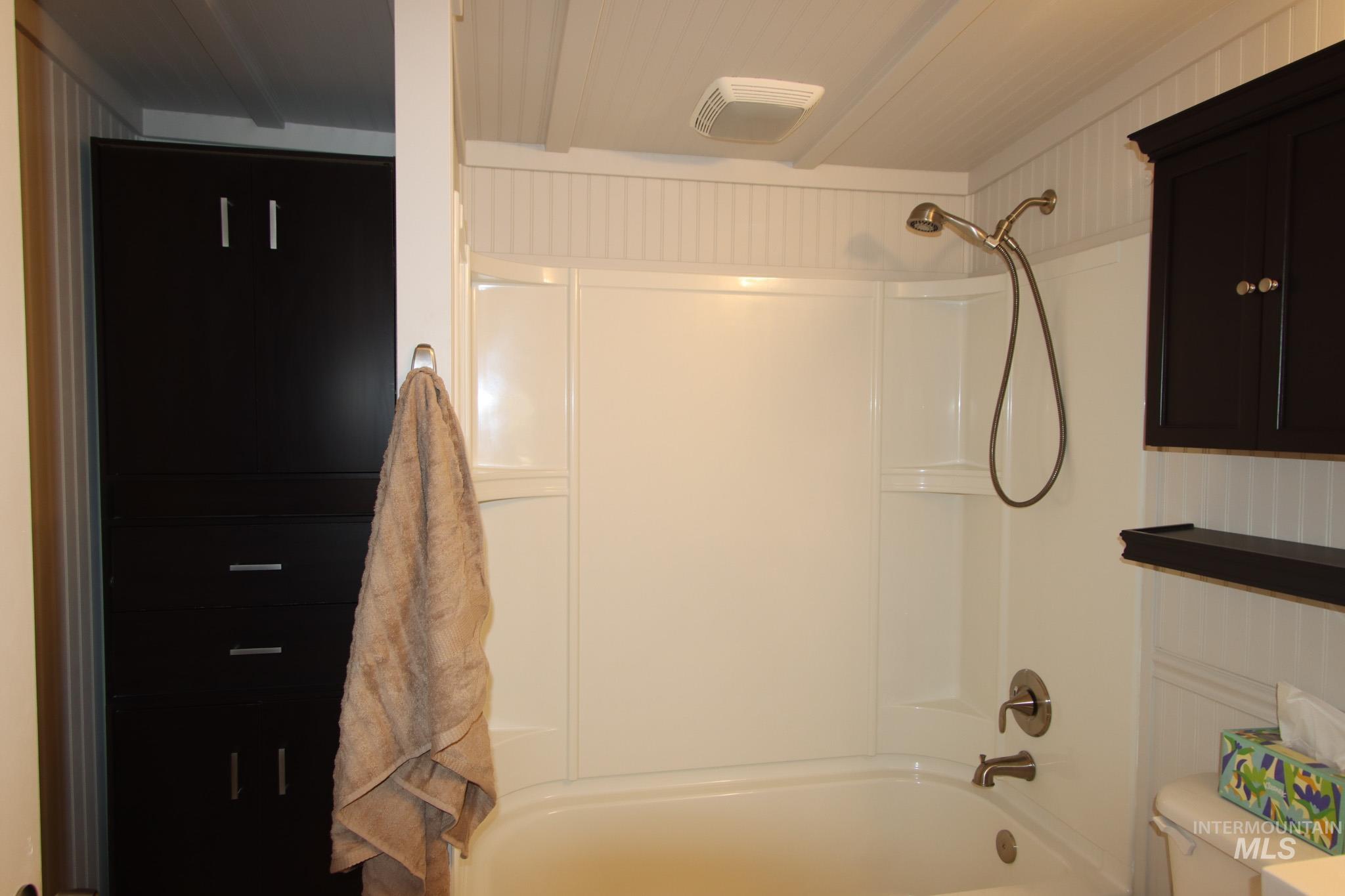Bathroom featuring  shower combination and toilet
