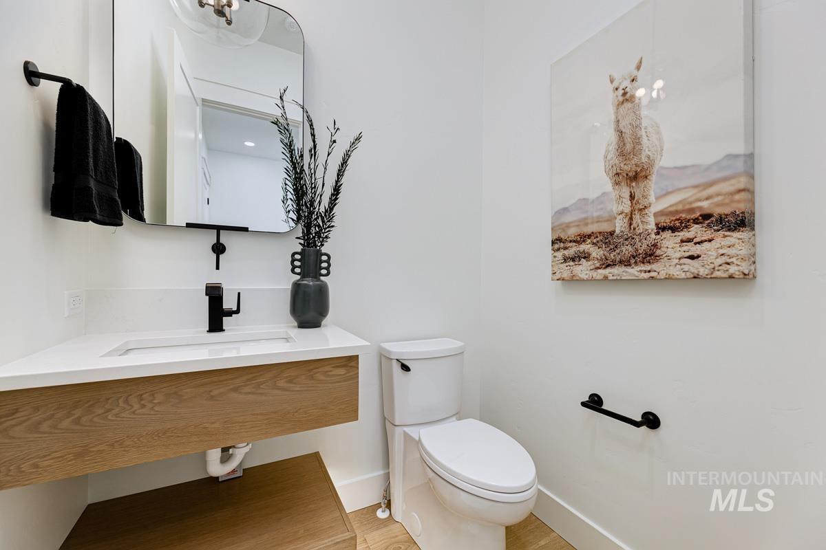Half bathroom with vanity and toilet