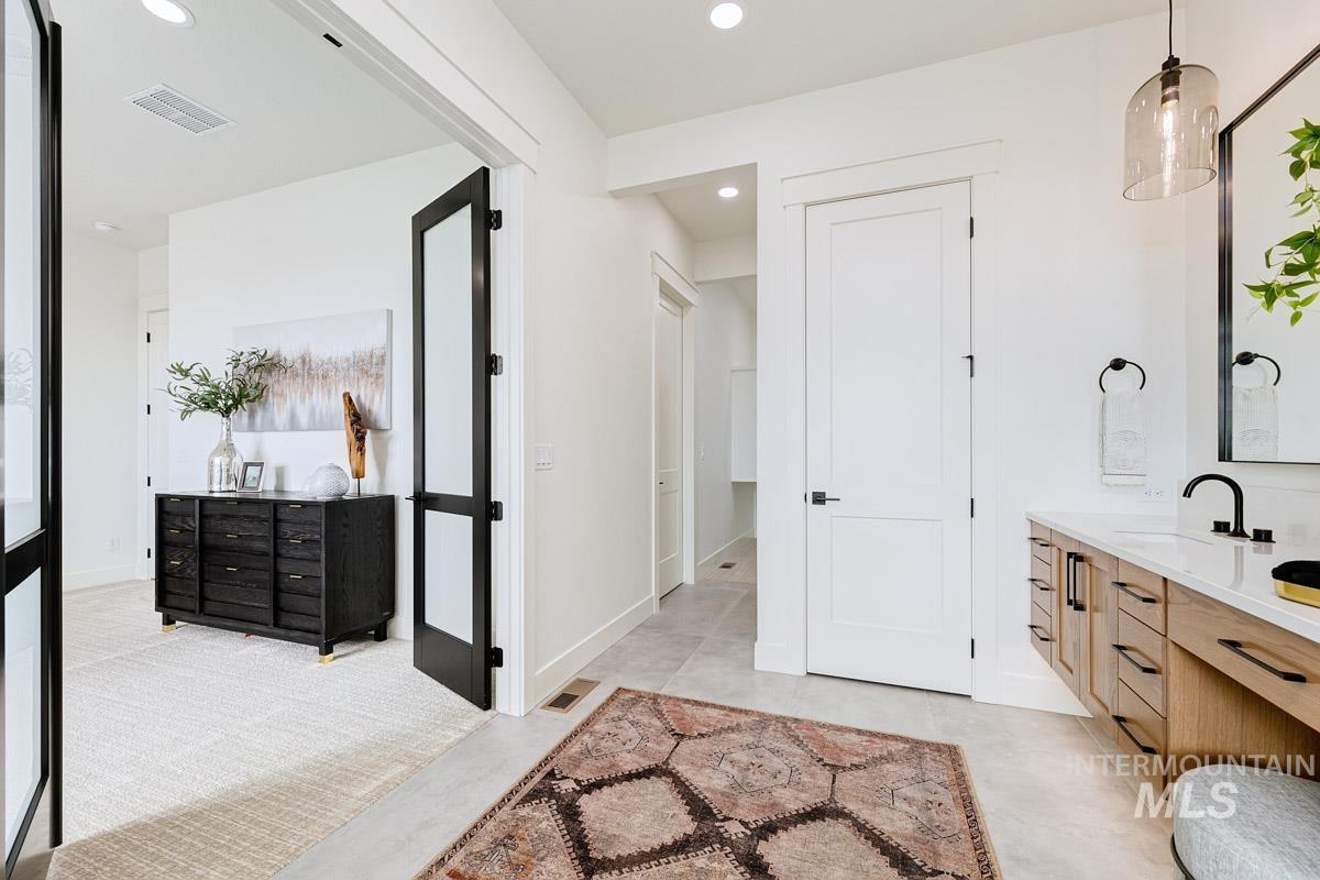 Bathroom with vanity and recessed lighting
