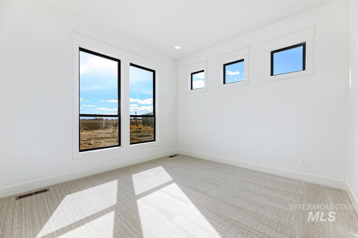 Unfurnished room featuring light colored carpet and recessed lighting