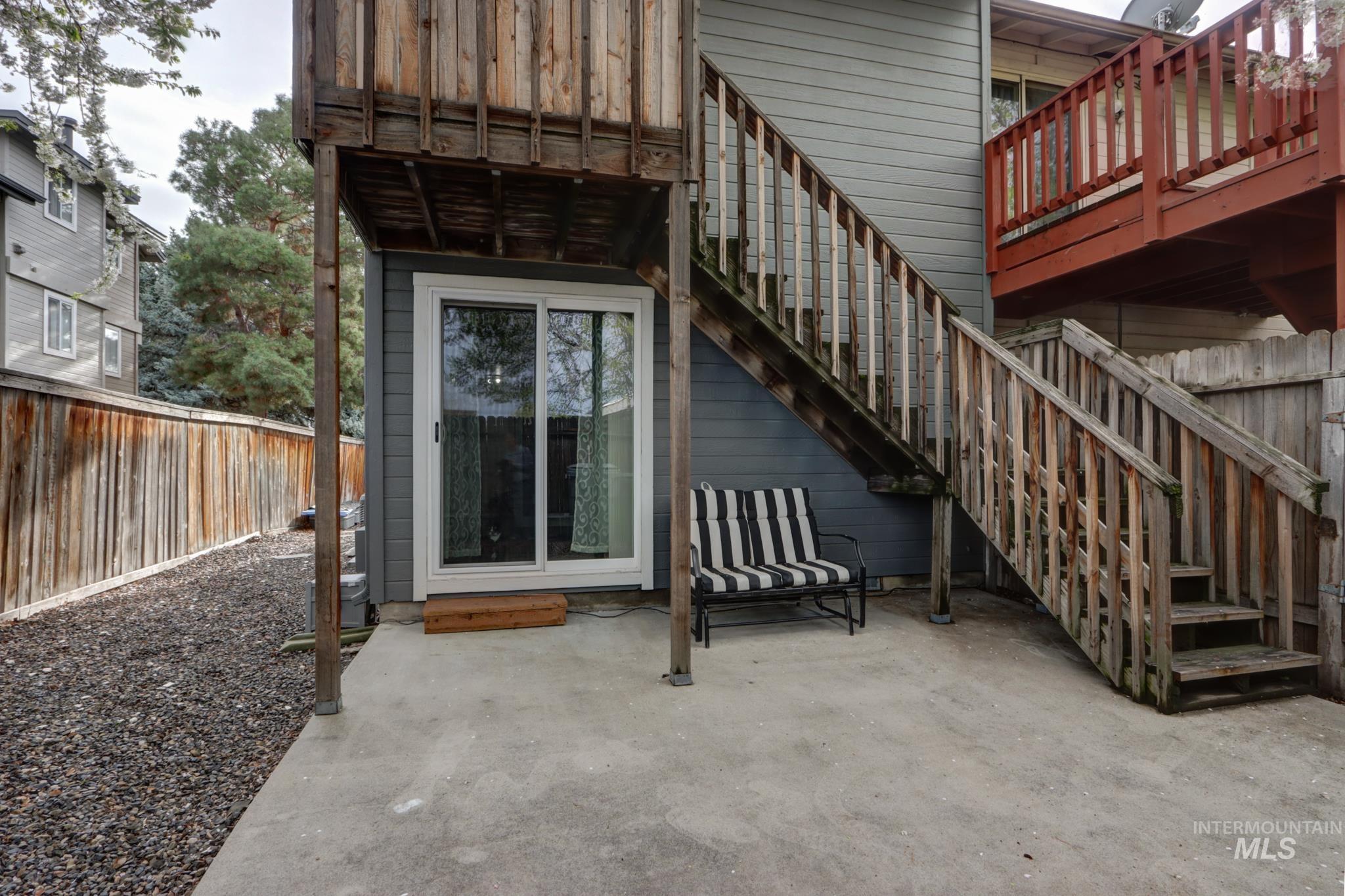 View of exterior entry with a patio area