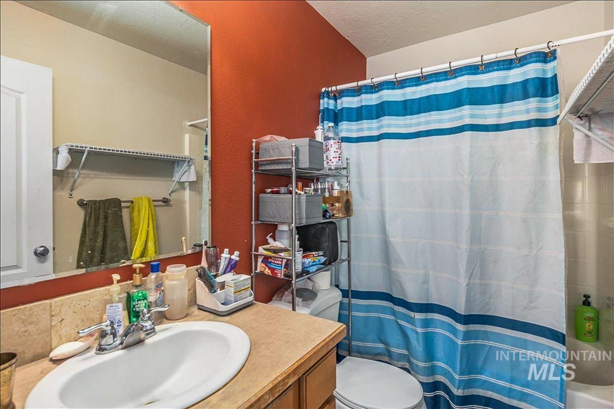 Bathroom with vanity and a textured ceiling