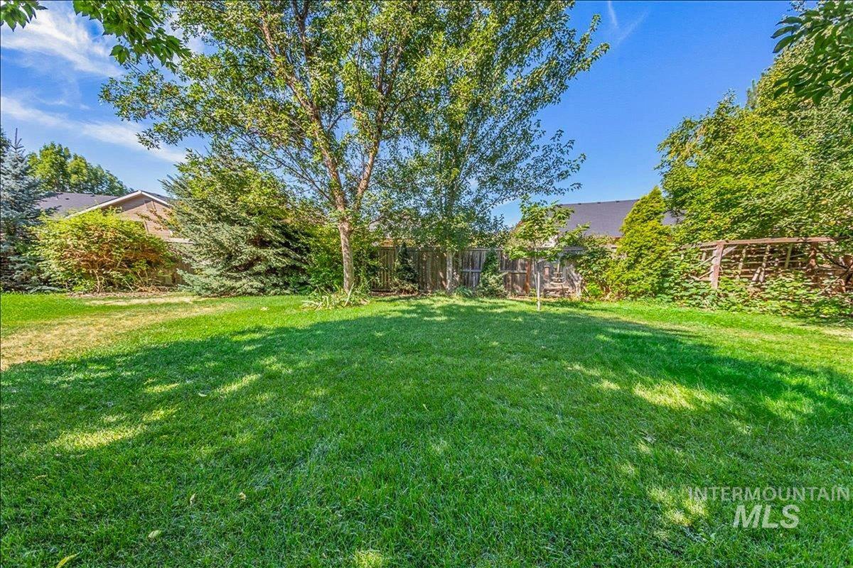View of fenced backyard