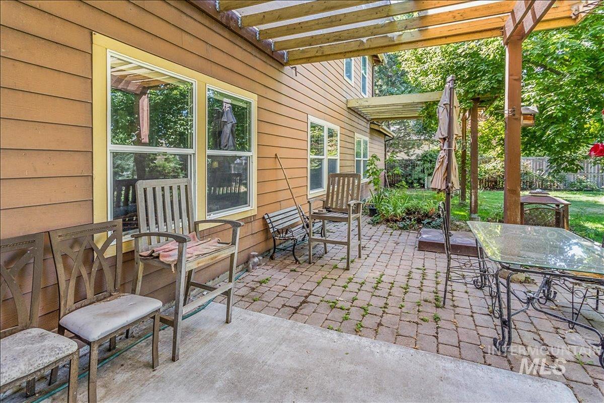 View of patio with a pergola and outdoor dining space