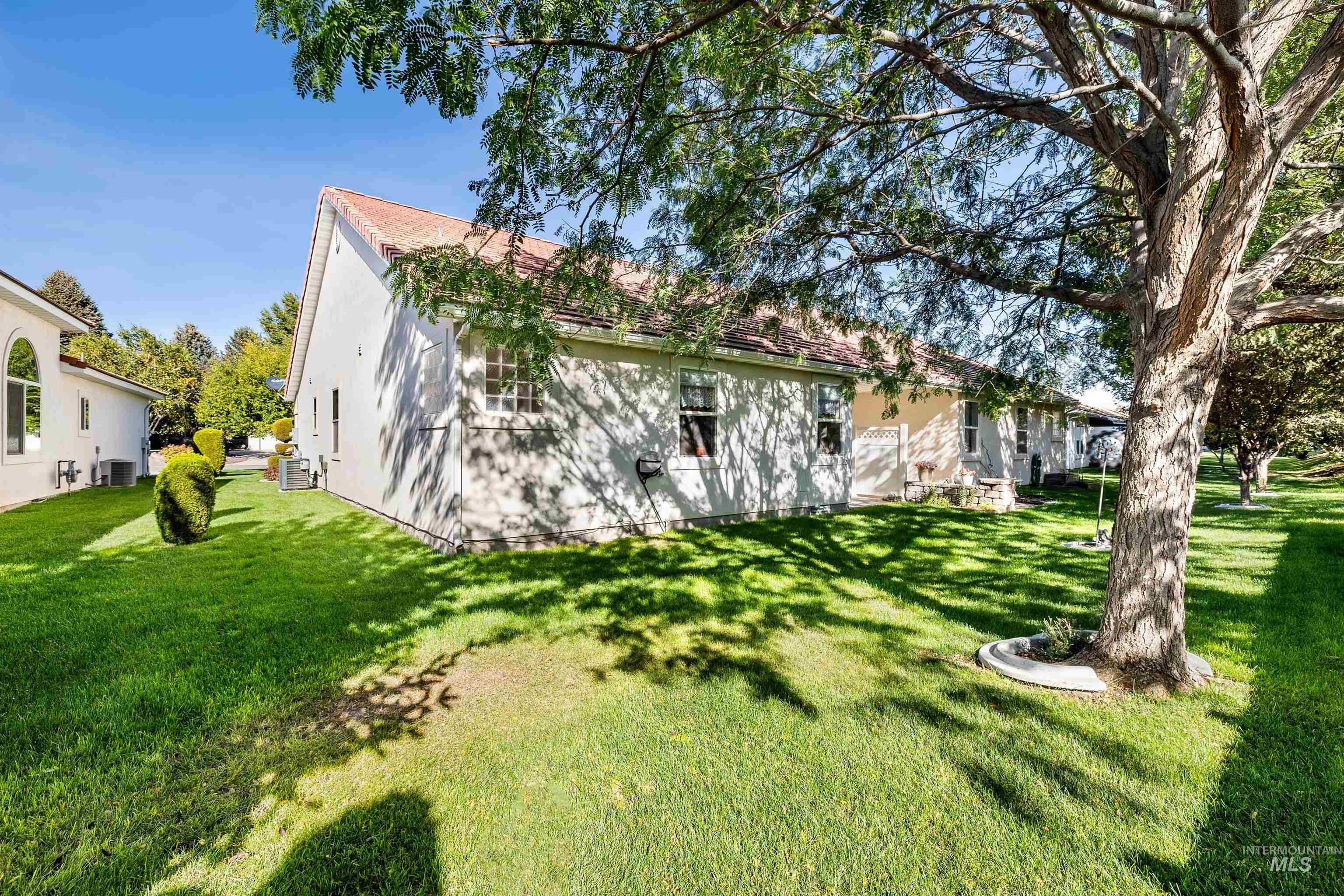 Rear view of house featuring a lawn