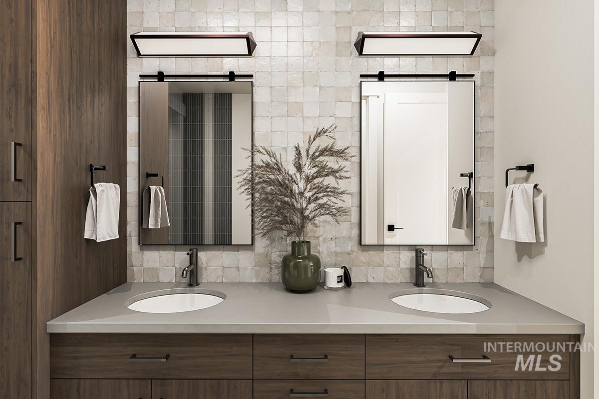 Bathroom with double vanity and backsplash