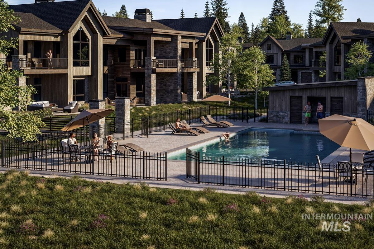 Community pool with a patio and a balcony