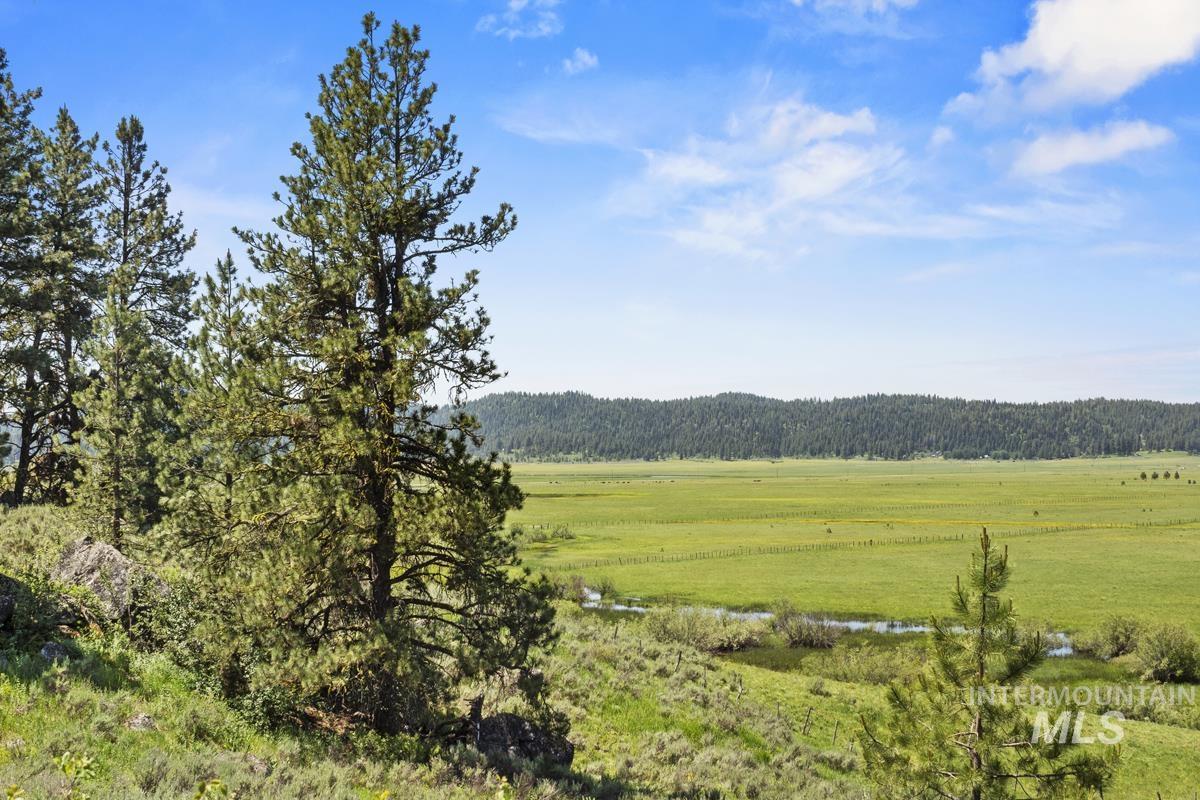 View of mountain backdrop featuring rural landscape