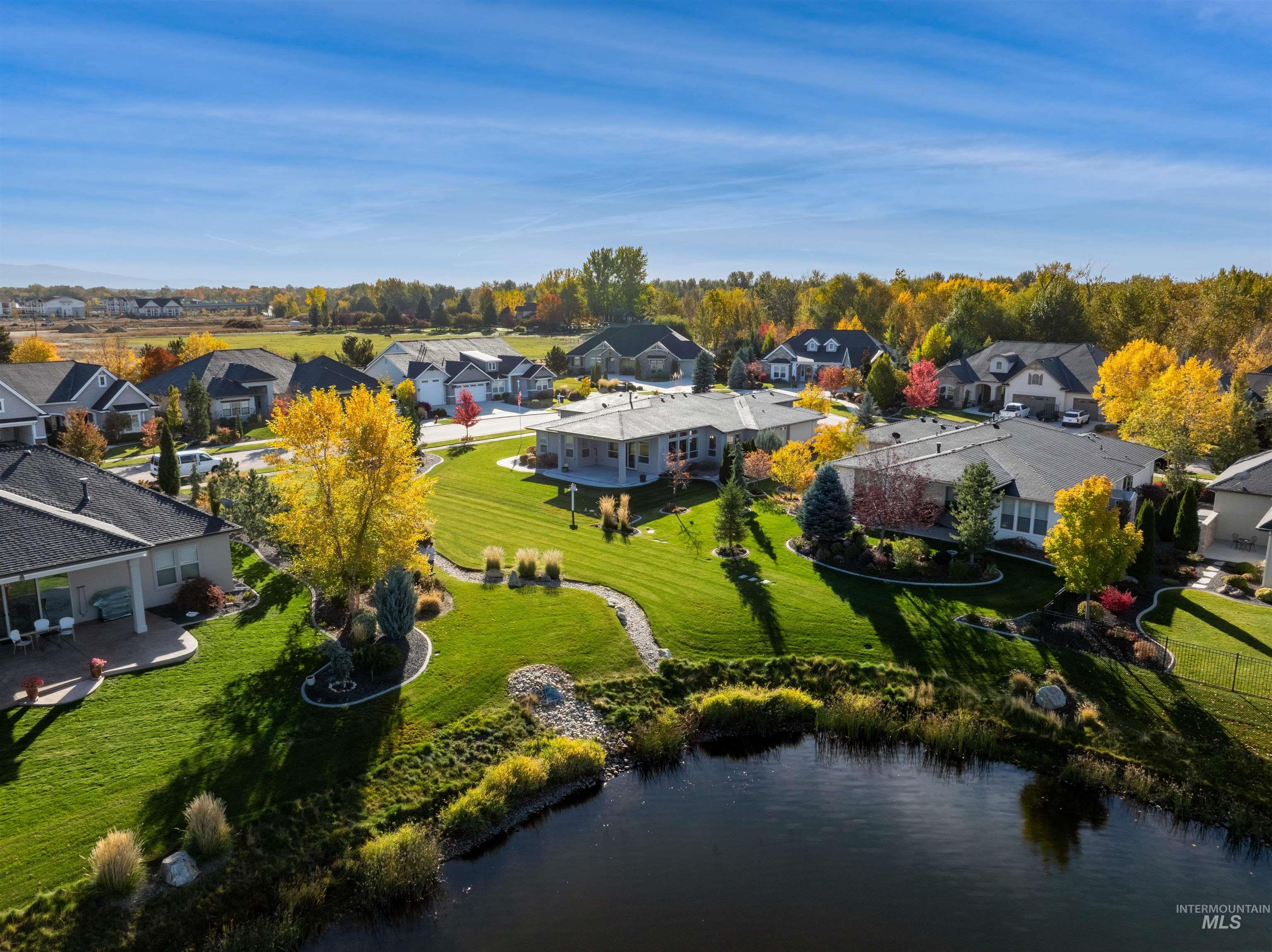 Aerial view of residential area featuring a large body of water