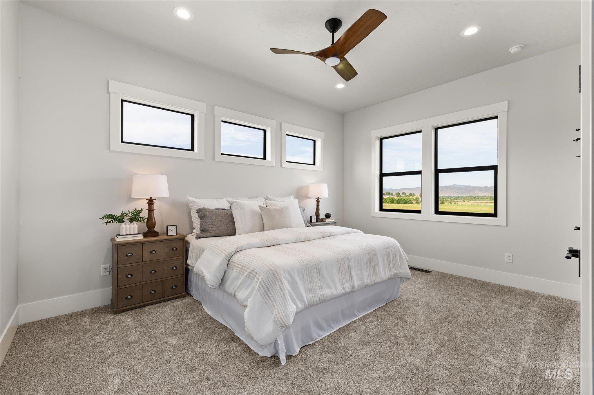 Bedroom featuring carpet, a ceiling fan, and recessed lighting