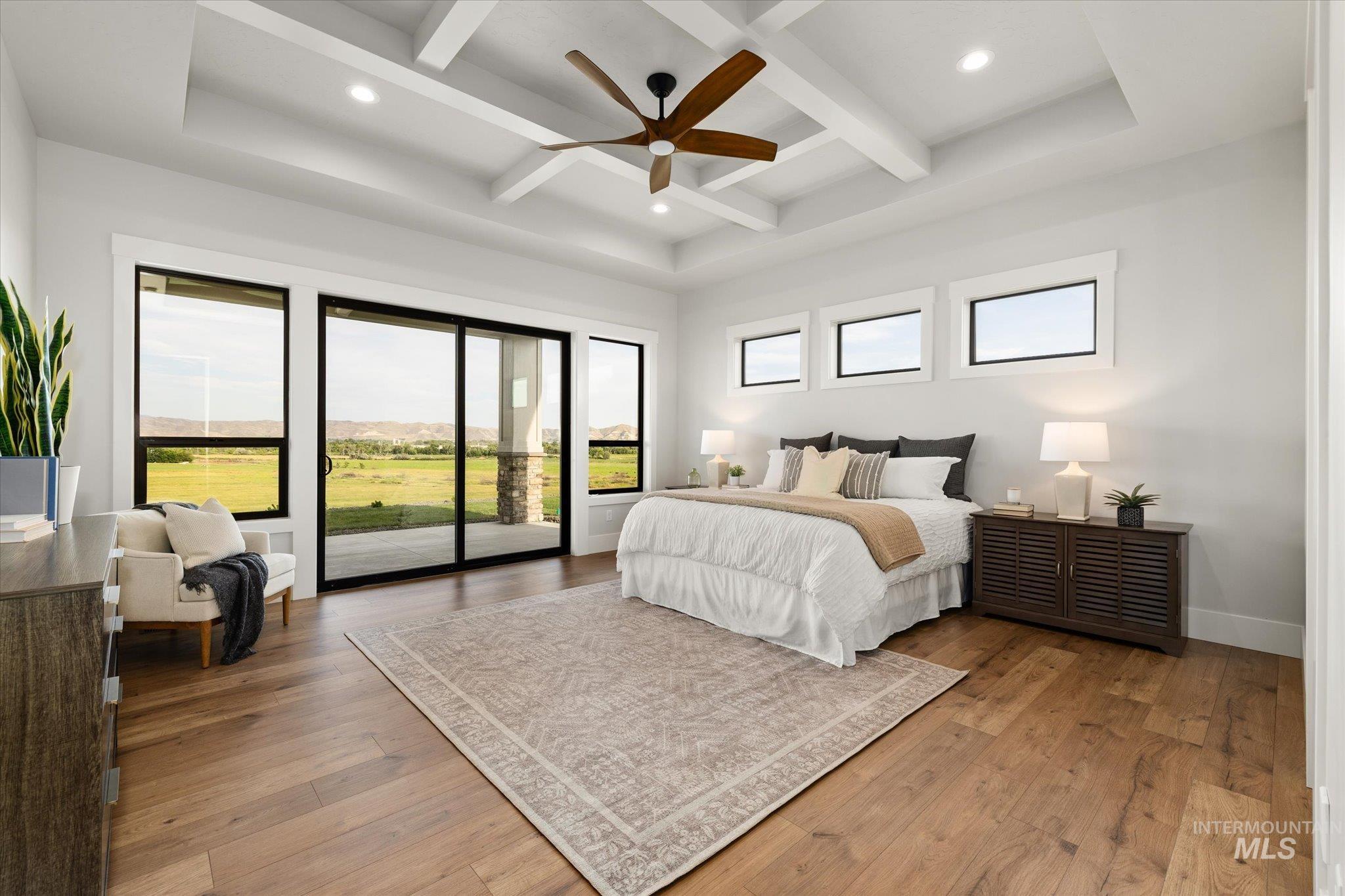 Bedroom with beam ceiling, recessed lighting, access to exterior, light wood-style flooring, and ceiling fan