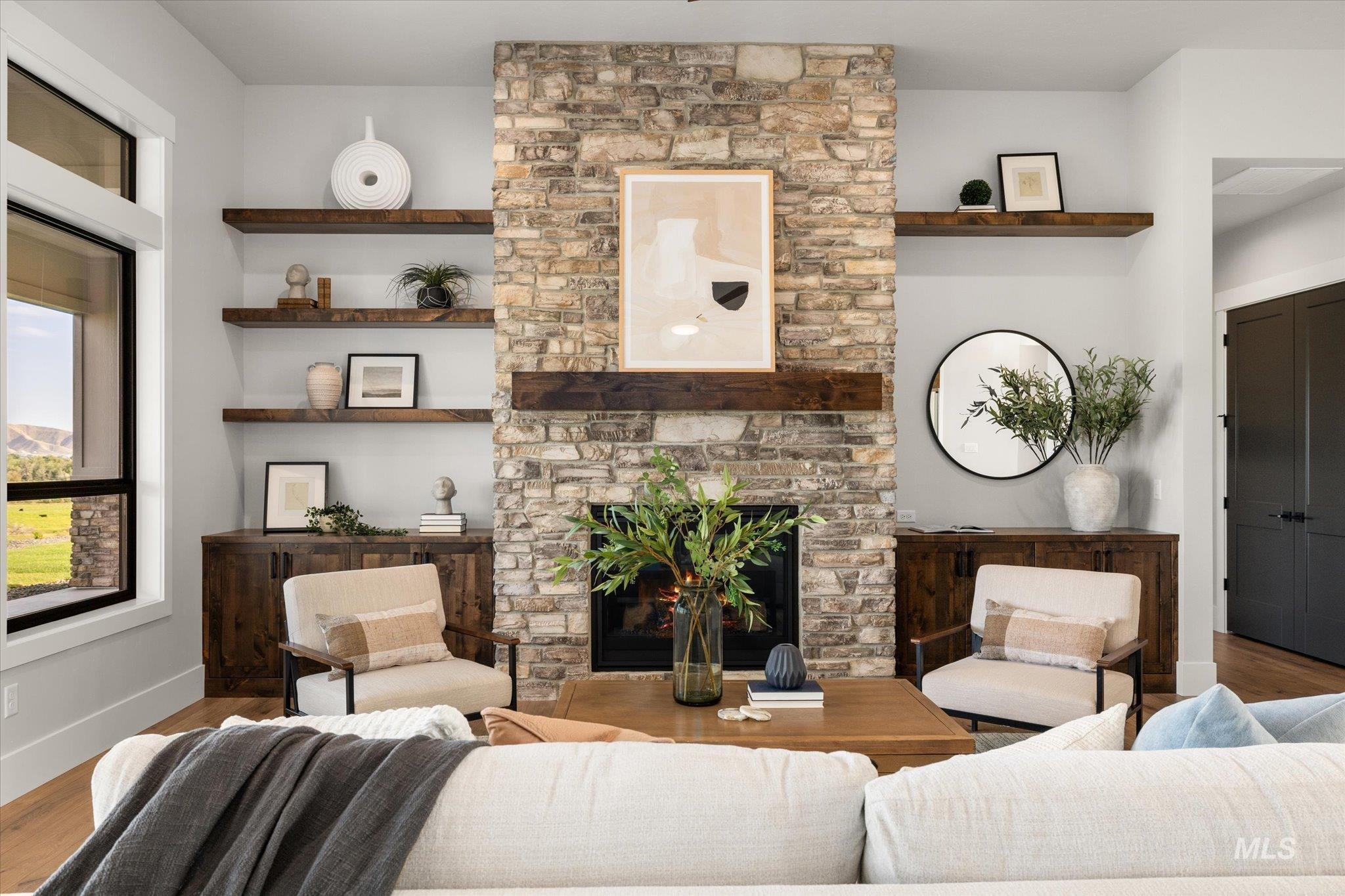 Living area featuring wood finished floors and a fireplace