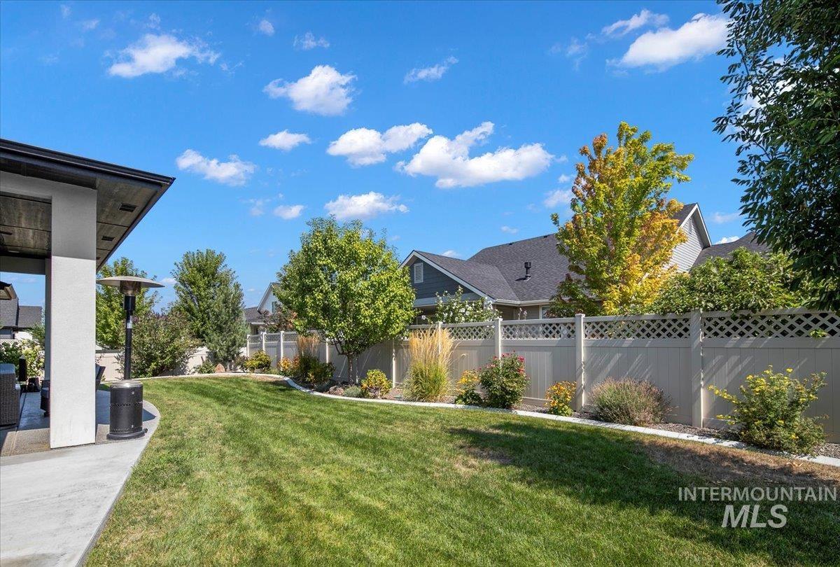 View of yard featuring a patio area and a residential view