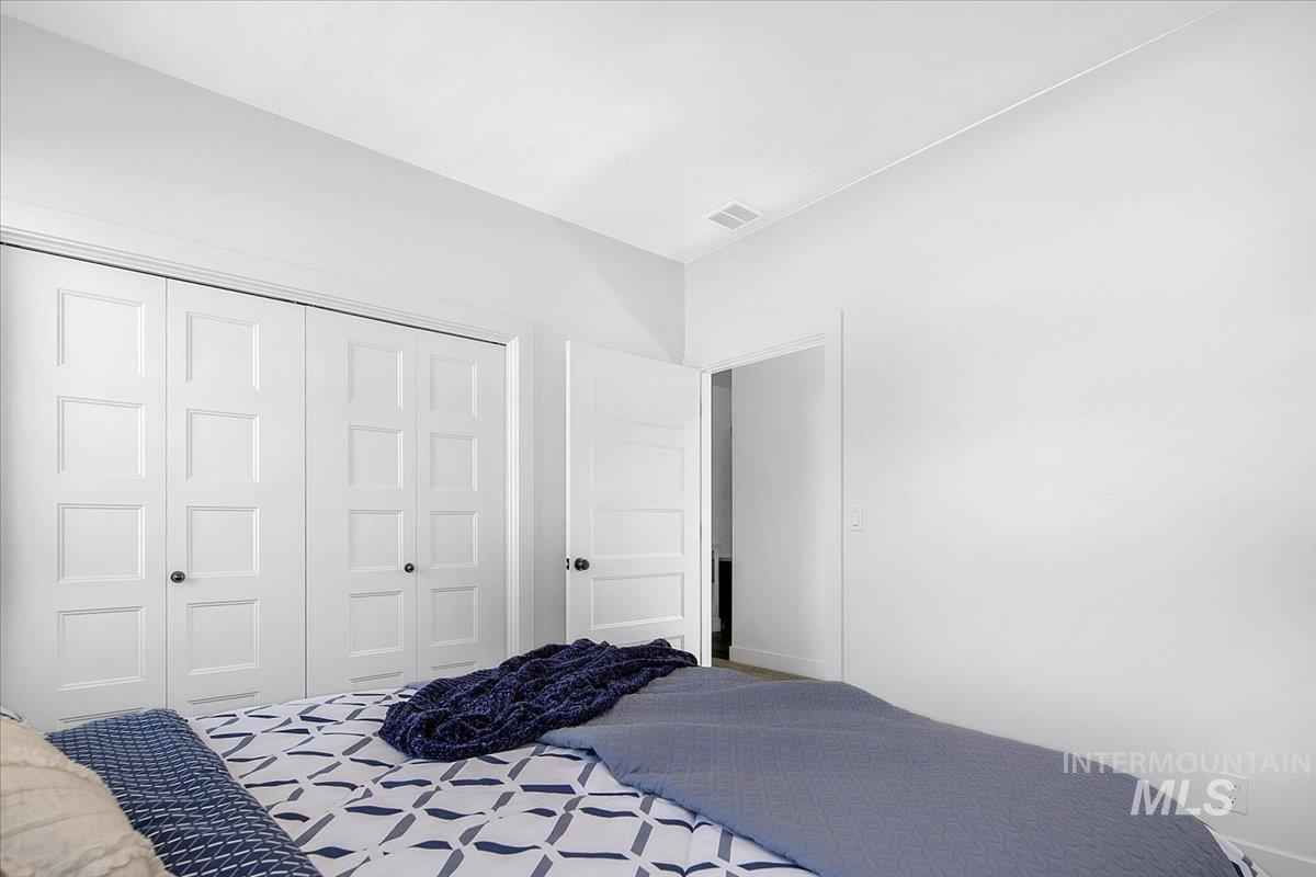 Bedroom with a closet and baseboards