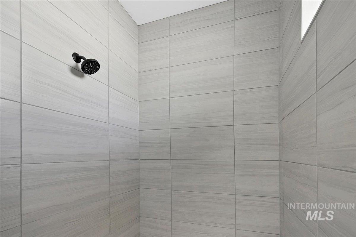 Bathroom view of a tile shower
