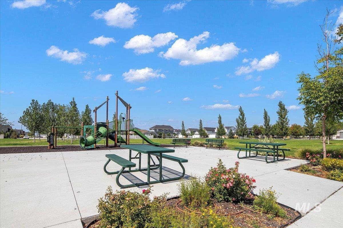 View of property's community with a yard