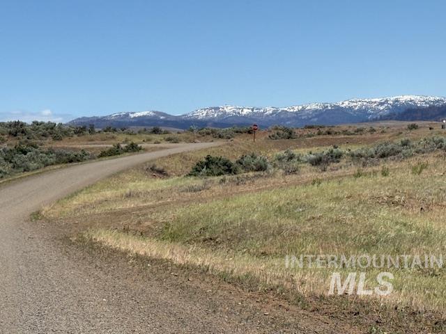 View of mountain backdrop featuring rural landscape