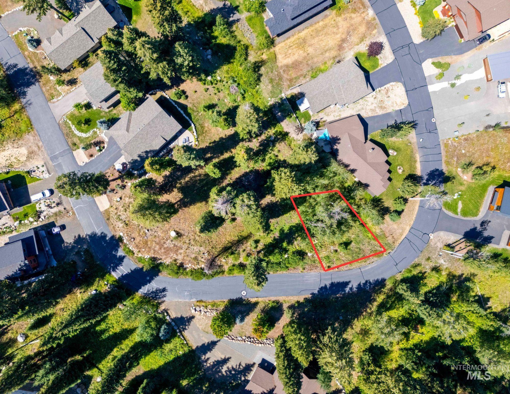 Aerial overview of property's location with property parcel outlined