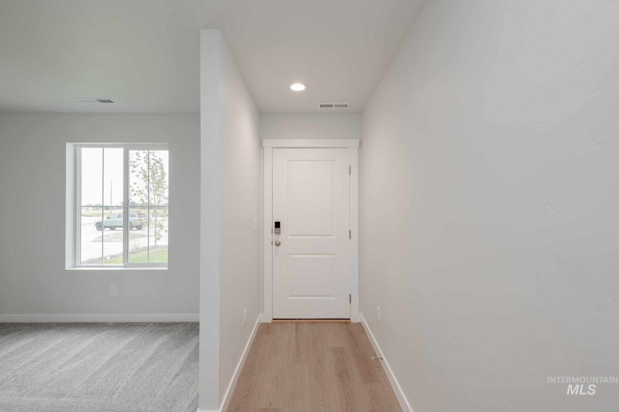 Hall featuring recessed lighting and light wood-style floors