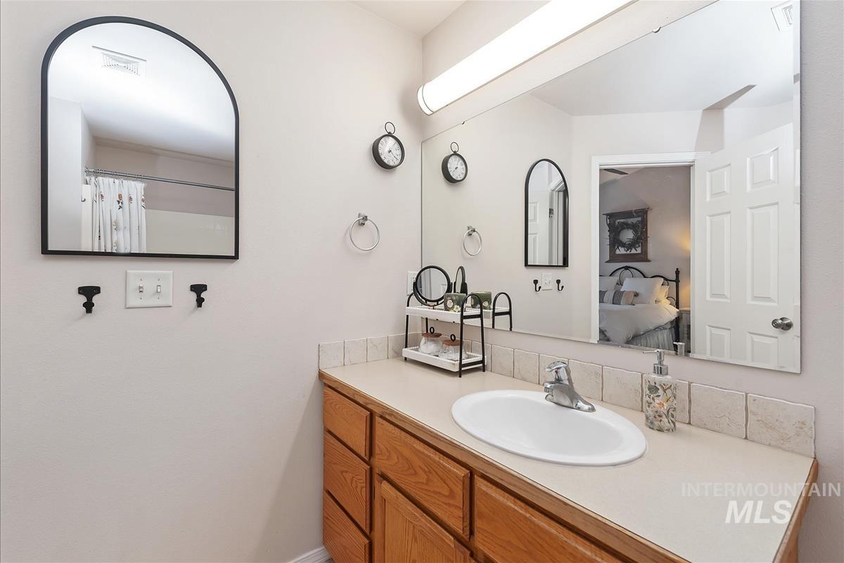 Full bathroom featuring vanity and a shower with curtain