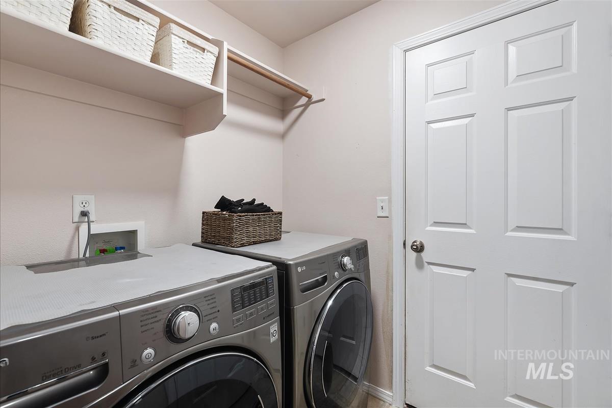 Washroom featuring washer and dryer