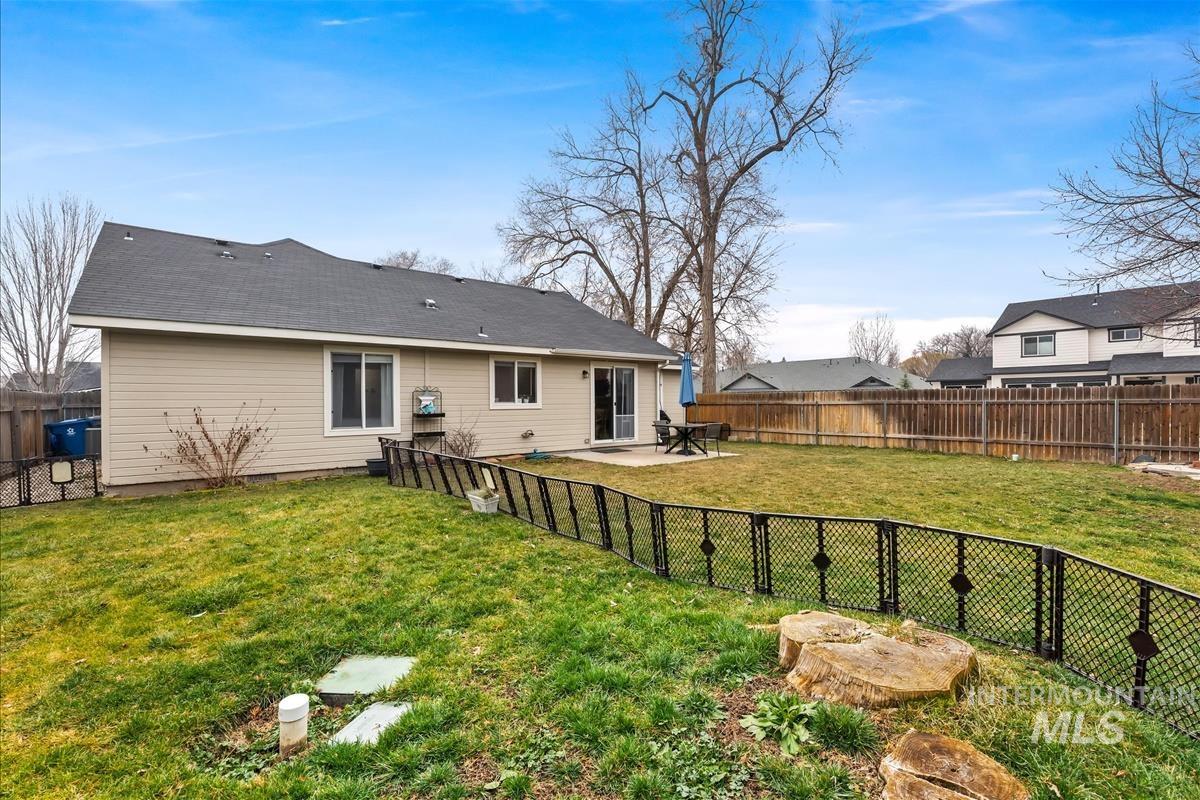 Back of property featuring a patio area and a fenced backyard