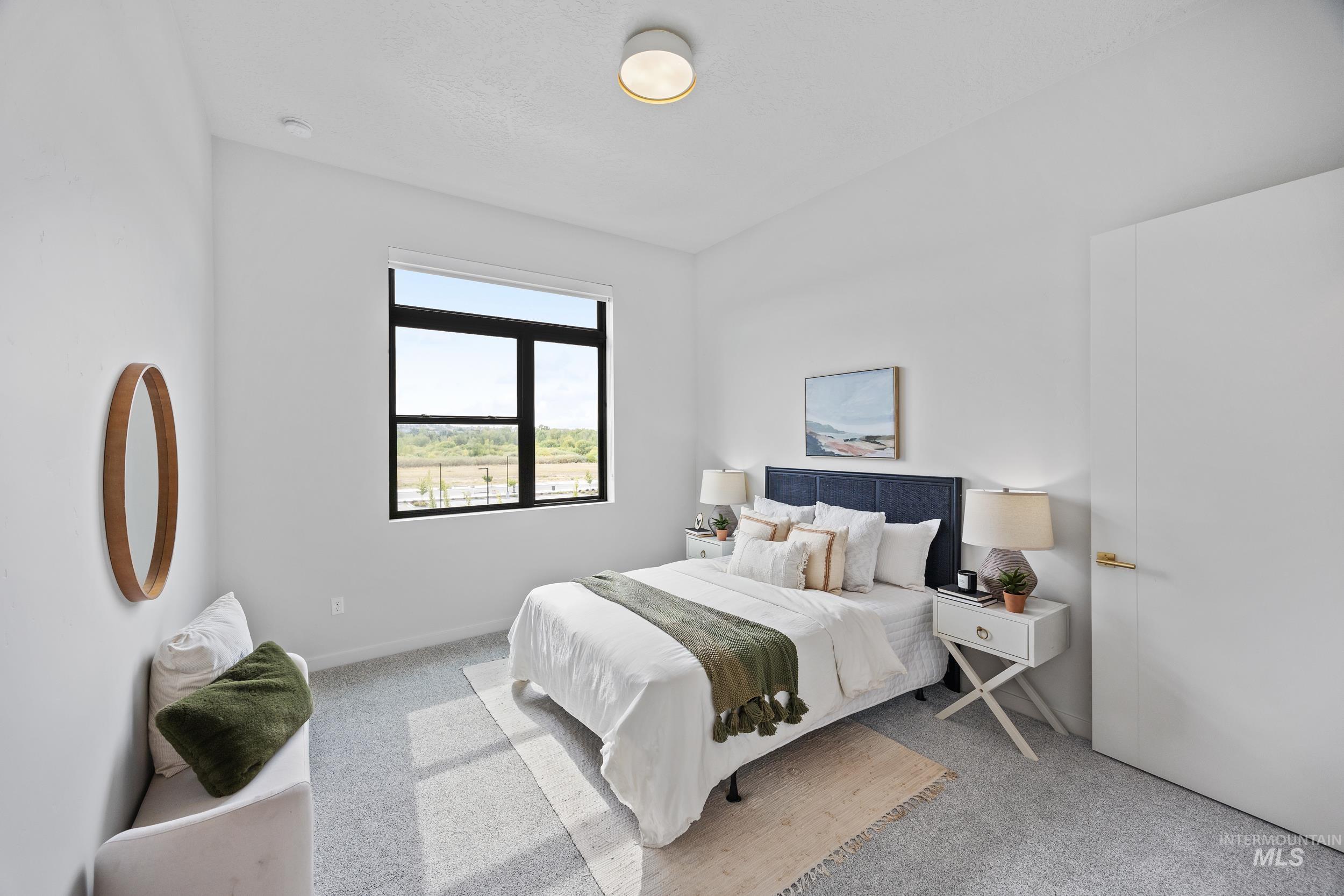 Carpeted bedroom with baseboards