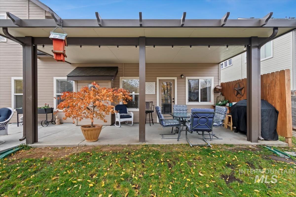 Back of property with a patio